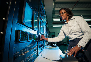 MP13-1114 Zelda Gills physics magazine 20130809 -- accompany Physics Today interview article -- Dr. Zelda Gills, avionics engineer for Lockheed Martin Aeronautics Company, runs a test during radar development for the C-130J aircraft in the radar systems integration laboratory in Marietta, Ga. -- Lockheed Martin Aeronautics Company, Marietta, Ga. Lockheed Martin Photography by Thinh D. Nguyen